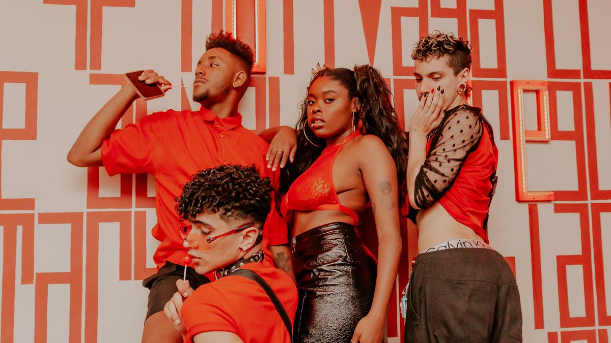 Diverse group of professional models posing confidently in bold outfits during a fashion editorial casting
